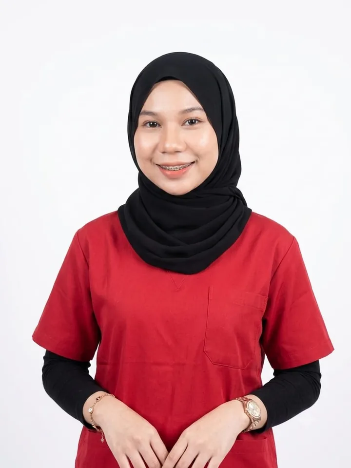Clinic assistant in red scrubs